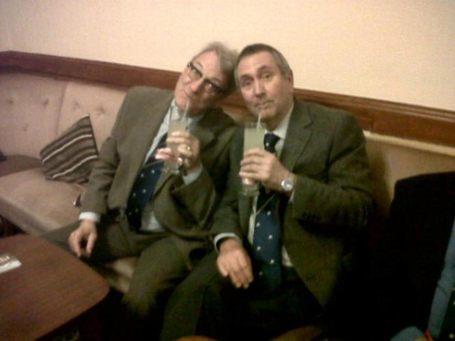 John and Alan with pink ribboned glasses of Ginger Beer